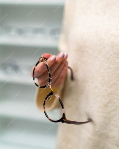 modern-correction-eyesight-lenses-young-woman-hands-stylish-eyeglasses-holding-hands_116317-21638