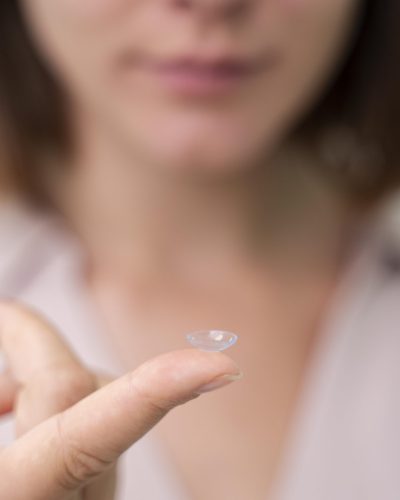 woman-checking-some-new-lenses-scaled.jpg